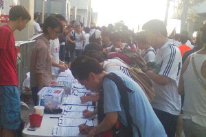 Marchers queuing to sign strike petition at Socialist Action stall in Admiralty