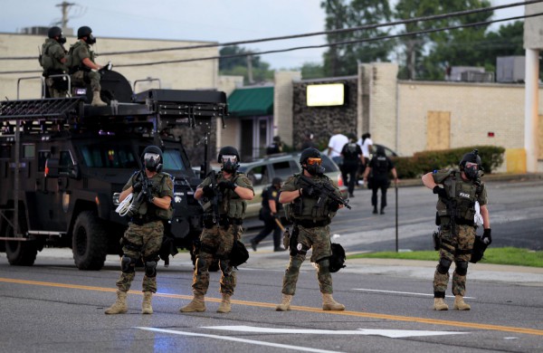 Police actions in Ferguson have been compared by angry veterans to US army tactics in Iraq.