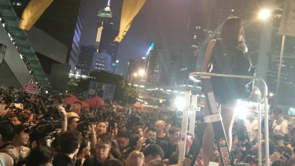 Sally Tang Mei-ching of Socialist Action speaks at Admiralty mass rally of 100,000 people on Saturday October 4.