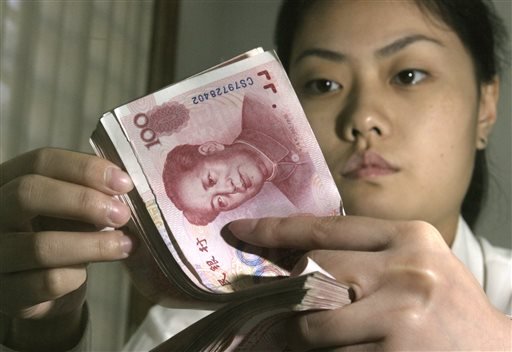 ap-chinas-currency-slides-after-beijing-announces-devaluation